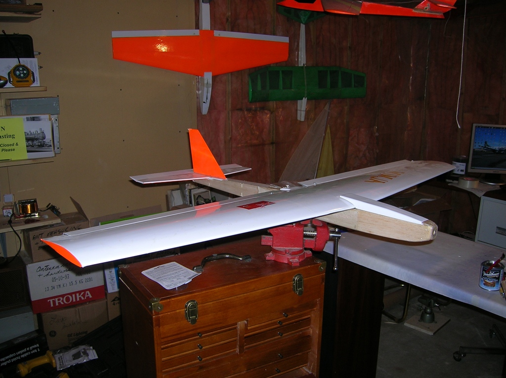 A scratch built fuselage to convert a slope soarer to brushless electric power with 3 lithium cells.  A few others hanging around.